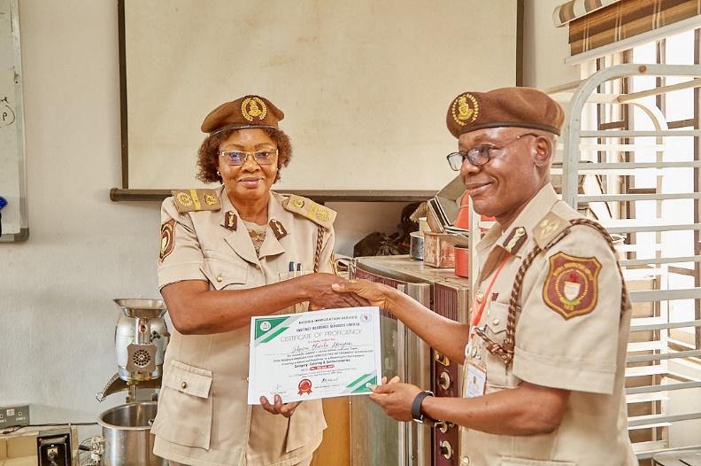 Presentation of Certificate to some of the participants of the Pre-Retirement Workshops.