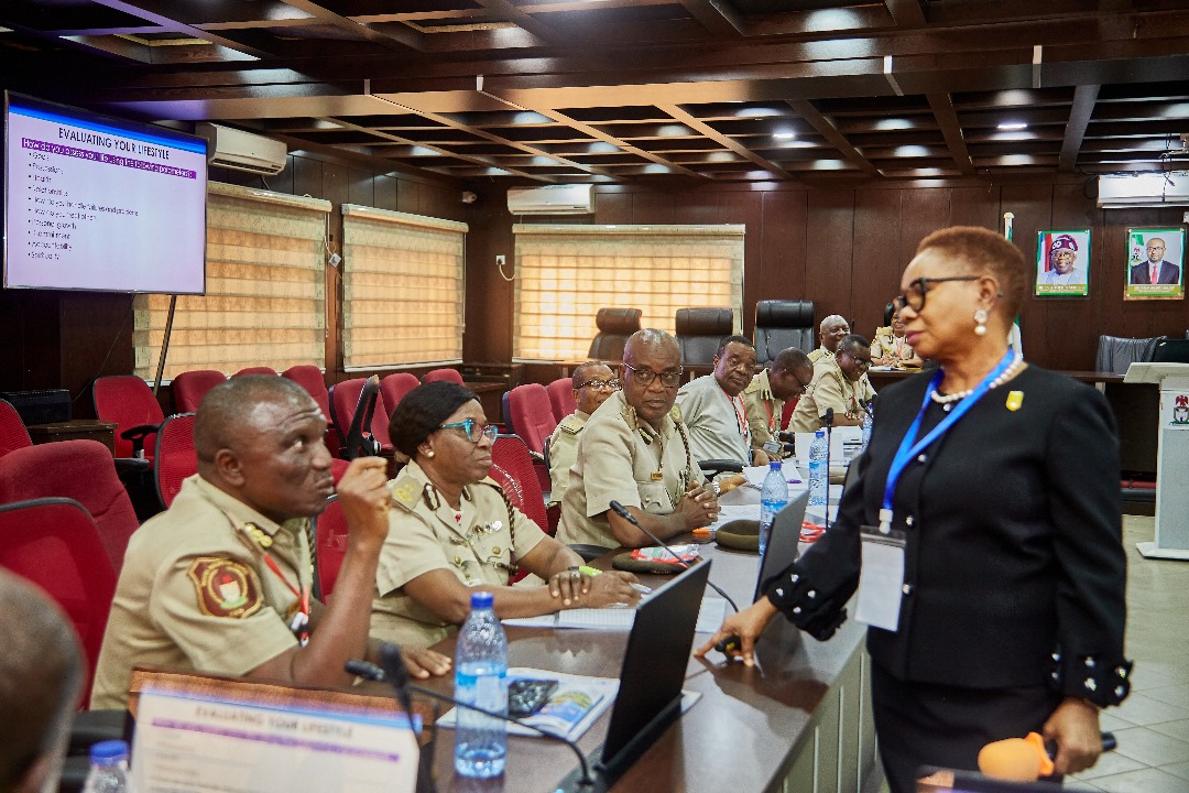 One of the facilitators, MS. Mary Uduk , mni and senior officers of the Nigeria Immigration Service during a training session organized by the Instinct Resource Services Limited