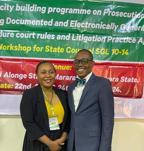 The company secretary with Afam Osigwe SAN during a workshop organized for the Federal Ministry of Justice